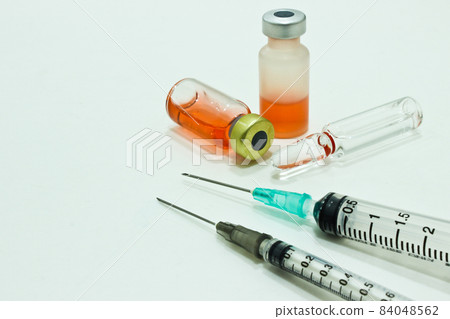 Vial and Ampule of Drugs,3 ml and 1 ml Plastic Syringe with Needle Isolated on the White Background Vial and Ampule of Drugs,3 ml and 1 ml Plastic Syringe with Needle Isolated on the White Background 84048562