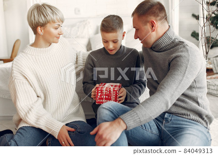 People in a winter clothes in a christmass atmosphere People in a winter clothes in a christmass atmosphere 84049313