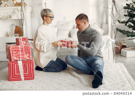People in a winter clothes in a christmass atmosphere People in a winter clothes in a christmass atmosphere 84049314