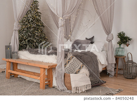 Christmas stylish morning bedroom with fir tree Christmas stylish morning bedroom with fir tree 84050248