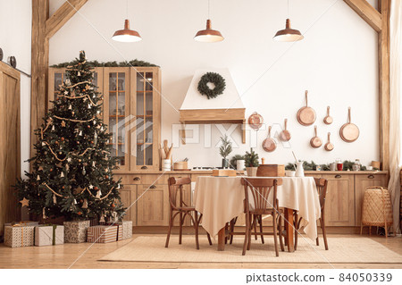 Festive christmas modern kitchen with big tree 84050339