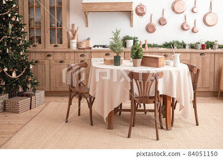 Festive christmas modern kitchen with big tree Festive christmas modern kitchen with big tree 84051150