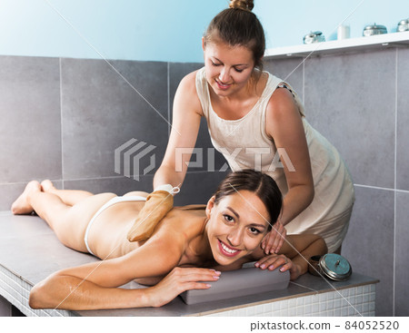 Massagist working in spa center Massagist working in spa center 84052520