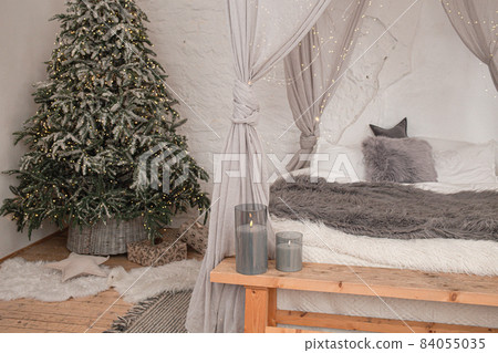 Christmas stylish morning bedroom with fir tree Christmas stylish morning bedroom with fir tree 84055035