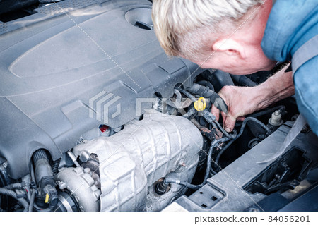 Car service auto. Automotive repair in garage workshop. Mechanic engine vehicle diagnostic. Technician maintenance. 84056201