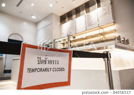 TEMPORARIRY CLOSED text with thai language with the same meaning on the Billboard in front of restaurant or coffee shop in department store 84056537