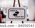 Check in and Check out text on the Billboard before walking in department store 84056543