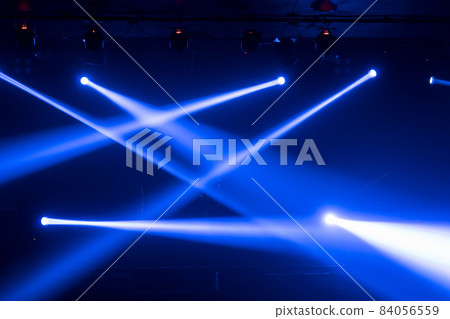 Abstract blurred photo of spotlight on the stage in conference hall or nightclub, silhouette audience or customer in restaurant,seminar and party environment,happy new year and merry christmas concept 84056559