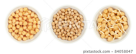 Boiled, dried and sprouted chickpeas, in white bowls. Cooked, raw and germinated chick peas, high in protein seeds of Cicer arietinum, a legume, also known as garbanzo beans or gram. Macro food photo. 84058047
