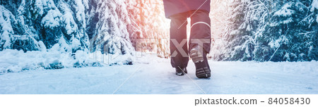 Loneliness woman walking in the winter forest 84058430