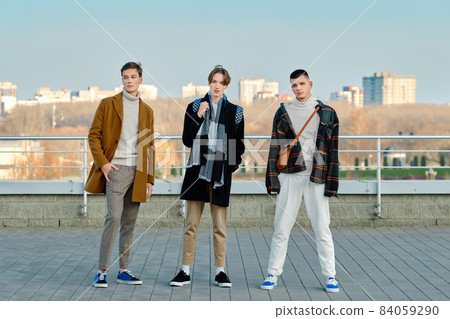 Three young men in casual clothes on the street Three young men in casual clothes on the street 84059290
