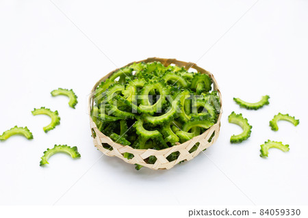 sliced bitter gourd on white background. 84059330