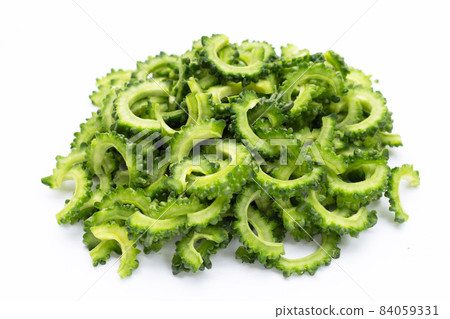 sliced bitter gourd on white background. 84059331