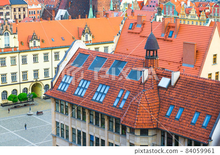 Top aerial view of buildings with tiled roofs, New City Hall and Rynek Market Square 84059961