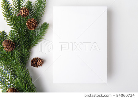 christmas 5x7 empty card mockup with Christmas tree twigs on a white background christmas 5x7 empty card mockup with Christmas tree twigs on a white background 84060724