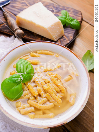Italian soup. Parmesan Pasta Passatel. Traditional Italian food from the northern regions. Italian soup. Parmesan Pasta Passatel. Traditional Italian food from the northern regions. 84061191