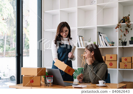 Two asian woman working together for SME project. Young Owner people startup for Business Online, SME, Delivery Project. Online Business Concept Two asian woman working together for SME project. Young Owner people startup for Business Online, SME, Delivery Project. Online Business Concept 84062643