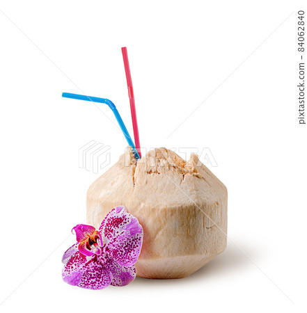 Fresh coconut water drink with orchid flower near Fresh coconut water drink with orchid flower near 84062840
