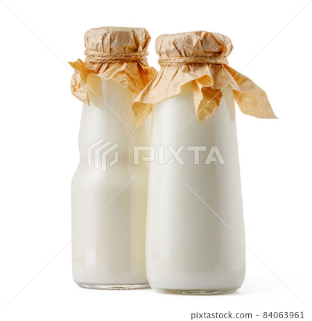 Glass milk bottle isolated on white background Glass milk bottle isolated on white background 84063961
