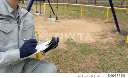 Workers inspecting swings | Inspection image of park playset Workers inspecting swings | Inspection image of park playset 84068560