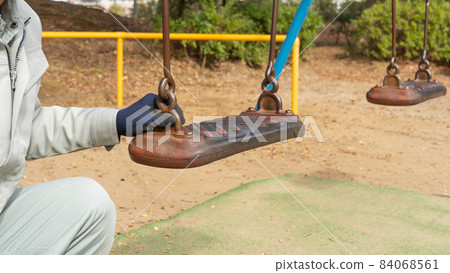 Workers inspecting swings | Inspection image of park playset Workers inspecting swings | Inspection image of park playset 84068561