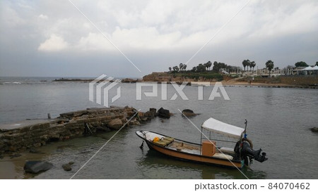 Caesarea National Archaeological Park in Israel boat and harbor Caesarea National Archaeological Park in Israel boat and harbor 84070462