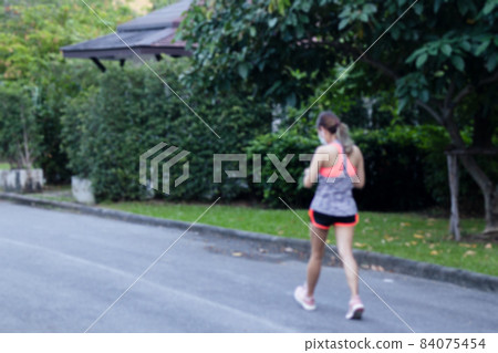 Blurred concept of woman walking in the park health care concept. Blurred concept of woman walking in the park health care concept. 84075454