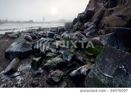 Landscape with a rocky coast at low tide Landscape with a rocky coast at low tide 84076097