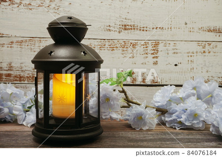 Black Lantern decorative with candles with space copy on wooden background Black Lantern decorative with candles with space copy on wooden background 84076184