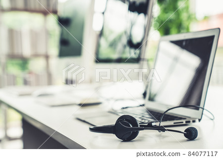 Headset and customer support equipment at call center ready for actively service 84077117