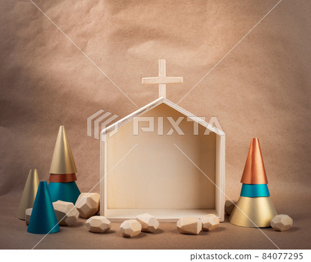 Minimal wooden Church and paper treess on brown paper background. DIY organic sustainable Christmas decoration. Minimal wooden Church and paper treess on brown paper background. DIY organic sustainable Christmas decoration. 84077295