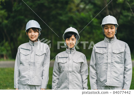 Worker wearing a helmet Worker wearing a helmet 84077442