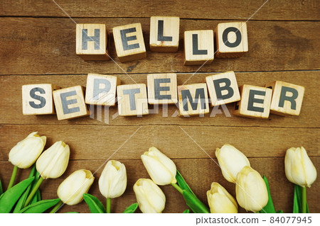 Hello September alphabet letters on wooden background Hello September alphabet letters on wooden background 84077945
