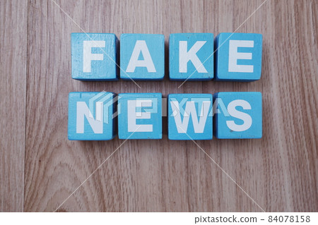 Fake News word alphabet letters on wooden background; Fake News word alphabet letters on wooden background; 84078158