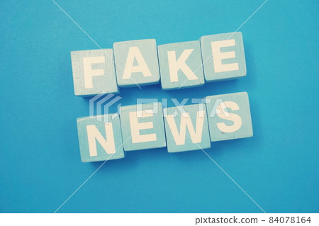 Fake News word alphabet letters on blue background; Fake News word alphabet letters on blue background; 84078164