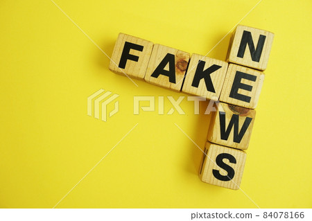 Fake News word alphabet letters on yellow background; Fake News word alphabet letters on yellow background; 84078166