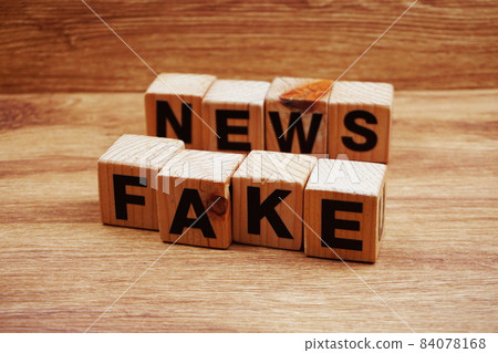 Fake News word alphabet letters on wooden background; Fake News word alphabet letters on wooden background; 84078168