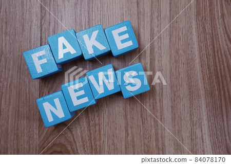 Fake News word alphabet letters on wooden background; Fake News word alphabet letters on wooden background; 84078170