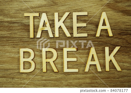 Take a Break text message on wooden background Take a Break text message on wooden background 84078177
