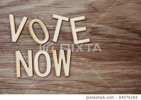 Vote Now Alphabet Letters on wooden background Vote Now Alphabet Letters on wooden background 84078268