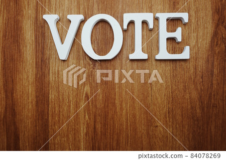 top view of wooden letters with word vote alphabet on wooden backgrou 84078269