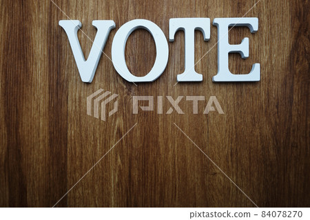 top view of wooden letters with word vote alphabet on wooden backgrou top view of wooden letters with word vote alphabet on wooden backgrou 84078270