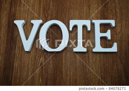 top view of wooden letters with word vote alphabet on wooden backgrou top view of wooden letters with word vote alphabet on wooden backgrou 84078271