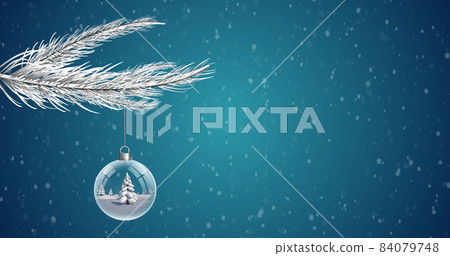 Christmas bauble dangling from Christmas tree against snowflakes falling on blue background Christmas bauble dangling from Christmas tree against snowflakes falling on blue background 84079748