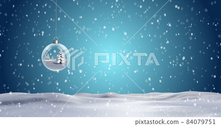Christmas bauble dangling against snowflakes falling on blue background Christmas bauble dangling against snowflakes falling on blue background 84079751