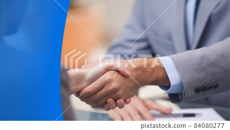 Composition of businessmen shaking hands with blue mesh border Composition of businessmen shaking hands with blue mesh border 84080277