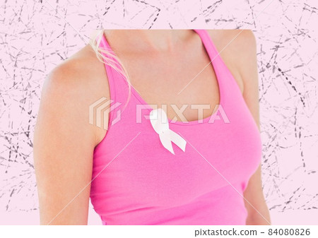 Mid section of woman wearing a pink ribbon on her sleeve against textured pink background Mid section of woman wearing a pink ribbon on her sleeve against textured pink background 84080826