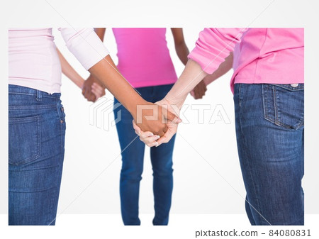 Low section of group of diverse women holding their hands against grey background 84080831