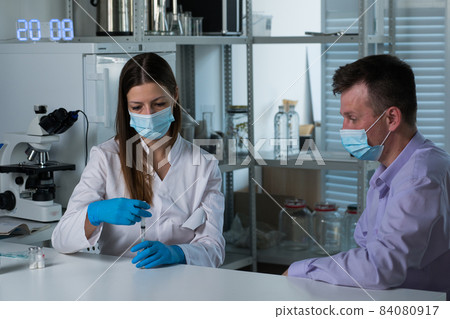 Doctor vaccinating patient in clinic. Medicine. Covid Doctor vaccinating patient in clinic. Medicine. Covid 84080917