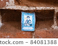 The image of the holy martyr, inserted into a niche in the brick wall. 84081388